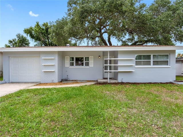2432 Keene Park Dr, Largo, FL 33771 - single story home featuring an attached garage, a front yard, and concrete driveway