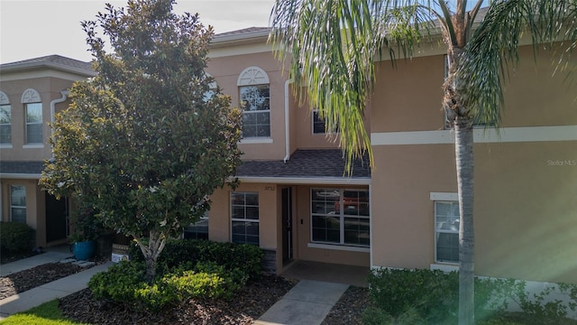 9752 Trumpet Vine Loop, Trinity, FL 34655 - view of front facade featuring stucco siding
