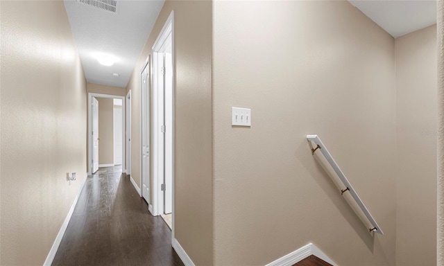9752 Trumpet Vine Loop, Trinity, FL 34655 - hall featuring an upstairs landing, dark wood-style flooring, and baseboards
