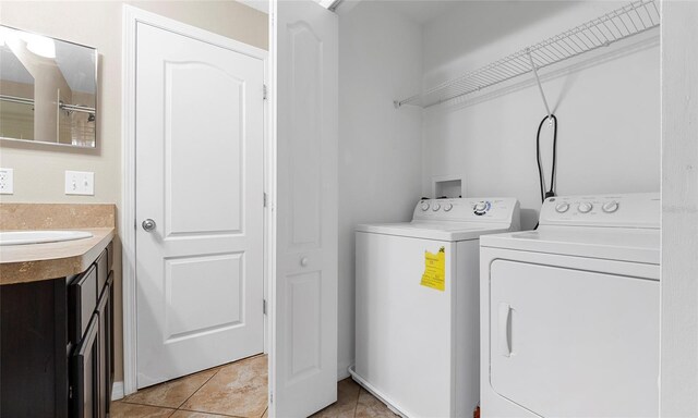 9752 Trumpet Vine Loop, Trinity, FL 34655 - laundry room featuring washer and dryer and light tile patterned floors