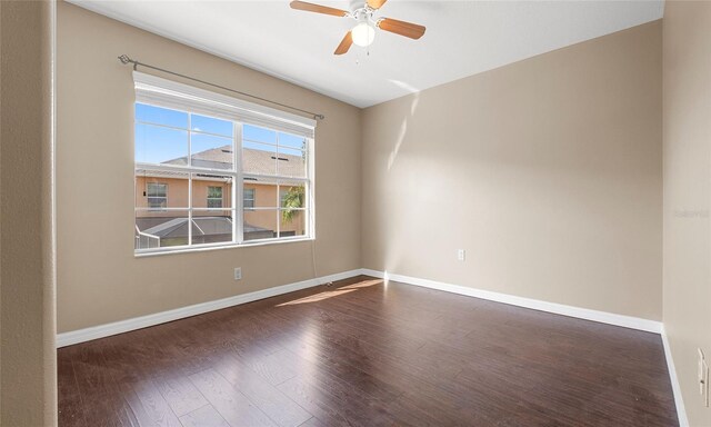 9752 Trumpet Vine Loop, Trinity, FL 34655 - spare room featuring a ceiling fan, wood-type flooring, and baseboards