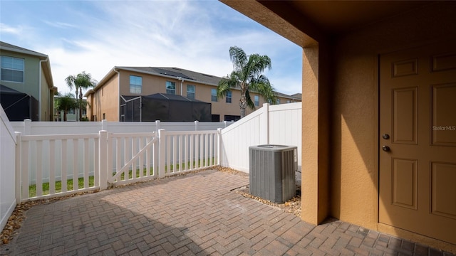 9752 Trumpet Vine Loop, Trinity, FL 34655 - fenced backyard with cooling unit, a patio, and a residential view