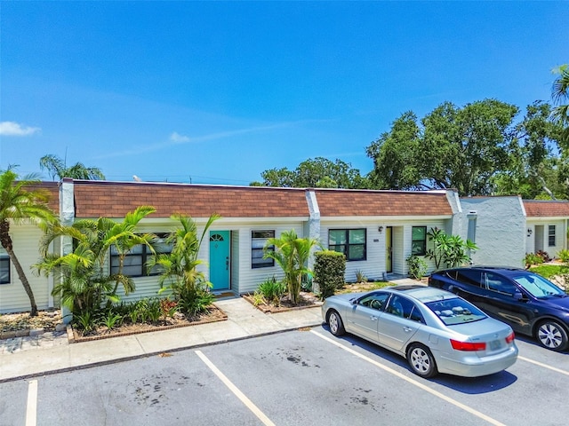 9142 Oakwood Ln, Seminole, FL 33776 - multi unit property with uncovered parking, mansard roof, and roof with shingles