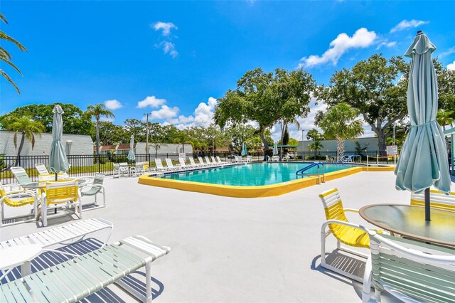 9142 Oakwood Ln, Seminole, FL 33776 - community pool featuring a patio area