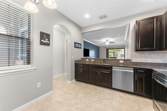 5153 Bay Isle Cir, Clearwater, FL 33760 - kitchen with dishwasher, a sink, a ceiling fan, arched walkways, and stove