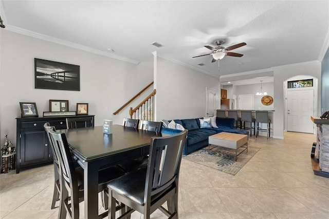 5153 Bay Isle Cir, Clearwater, FL 33760 - dining room featuring a ceiling fan, stairs, crown molding, and light tile patterned floors
