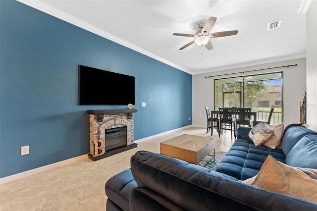 5153 Bay Isle Cir, Clearwater, FL 33760 - carpeted living area with ceiling fan, crown molding, baseboards, and a fireplace
