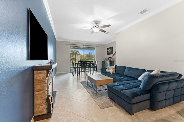 5153 Bay Isle Cir, Clearwater, FL 33760 - living room with crown molding, a ceiling fan, stairway, light tile patterned floors, and baseboards