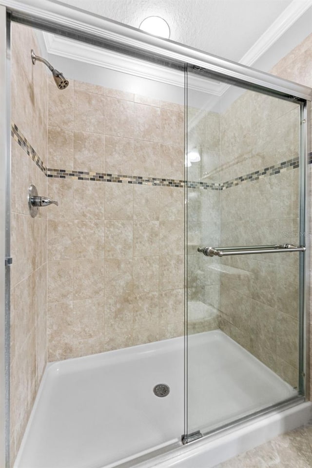 5153 Bay Isle Cir, Clearwater, FL 33760 - full bathroom with a stall shower and ornamental molding