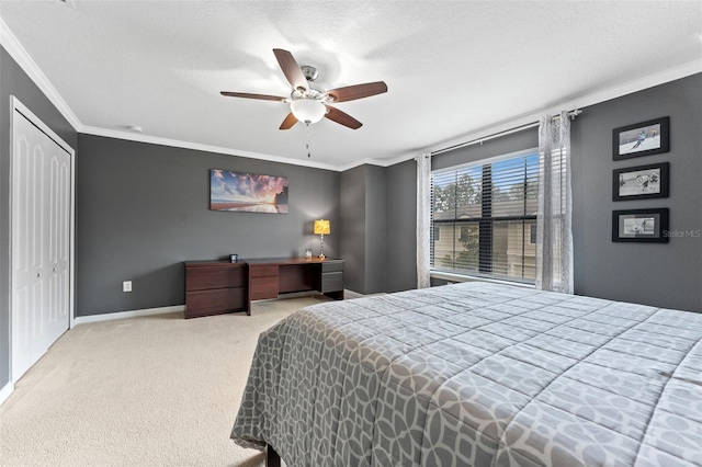 5153 Bay Isle Cir, Clearwater, FL 33760 - bedroom with ornamental molding, carpet, a closet, a ceiling fan, and baseboards