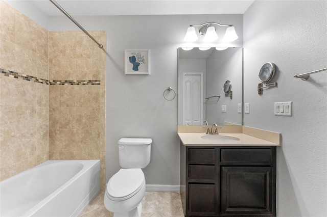 5153 Bay Isle Cir, Clearwater, FL 33760 - bathroom featuring toilet, vanity,  shower combination, tile patterned floors, and baseboards