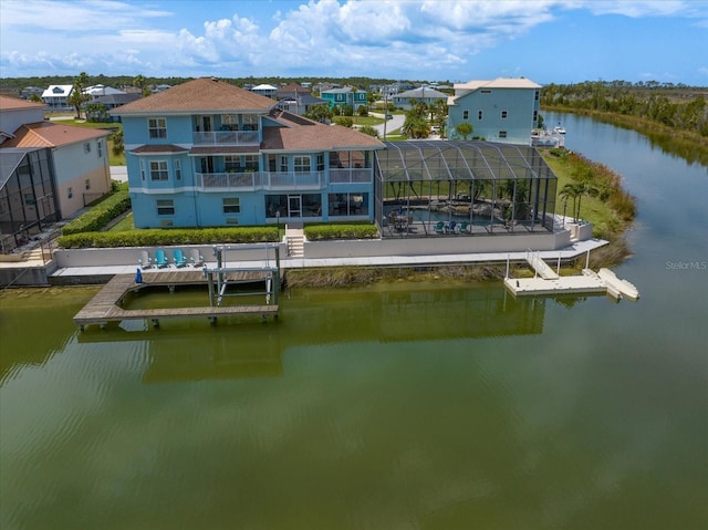 3397 Bluefish Dr, Hernando Beach, FL 34607 - rear view of property with a water view, a swimming pool, a balcony, a lanai, and a patio