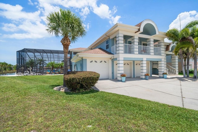 3397 Bluefish Dr, Hernando Beach, FL 34607 - view of front of house featuring a balcony, concrete driveway, stucco siding, and a front yard