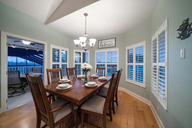 3397 Bluefish Dr, Hernando Beach, FL 34607 - dining room featuring a chandelier and light wood-style flooring