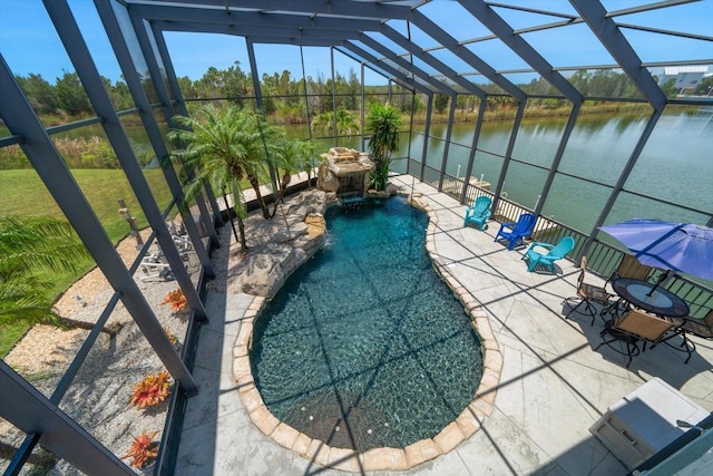 3397 Bluefish Dr, Hernando Beach, FL 34607 - outdoor pool featuring a patio, a lanai, and a water view