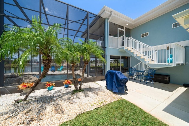 3397 Bluefish Dr, Hernando Beach, FL 34607 - view of yard featuring stairway, a patio area, and a lanai