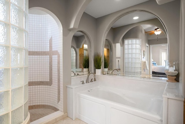 3397 Bluefish Dr, Hernando Beach, FL 34607 - bathroom with ceiling fan, a walk in shower, a bath, connected bathroom, and recessed lighting