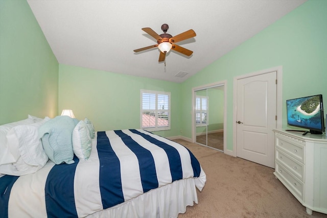 3397 Bluefish Dr, Hernando Beach, FL 34607 - bedroom with lofted ceiling, light carpet, a ceiling fan, and a closet