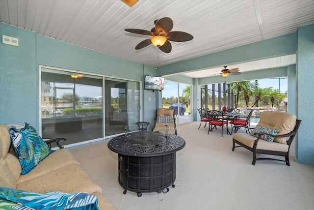 3397 Bluefish Dr, Hernando Beach, FL 34607 - view of patio with outdoor dining area, ceiling fan, grilling area, and a fire pit