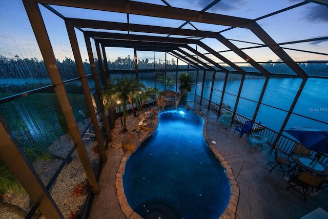 3397 Bluefish Dr, Hernando Beach, FL 34607 - pool at dusk featuring a patio area, a lanai, and an outdoor pool