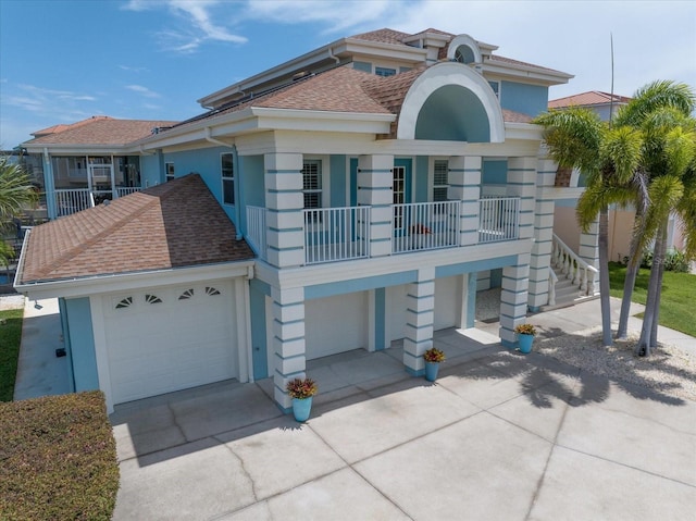 3397 Bluefish Dr, Hernando Beach, FL 34607 - view of front facade featuring concrete driveway, stucco siding, an attached garage, and roof with shingles