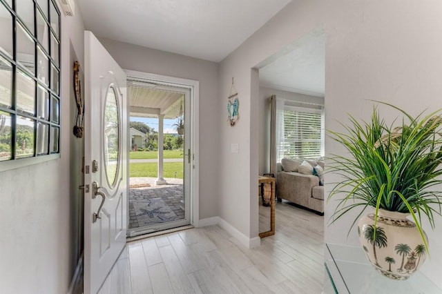 64 Alberta Ave, Ponce Inlet, FL 32127 - entryway featuring plenty of natural light and baseboards