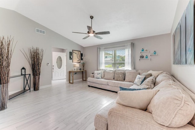 64 Alberta Ave, Ponce Inlet, FL 32127 - living area featuring vaulted ceiling, ceiling fan, light wood-style flooring, and baseboards