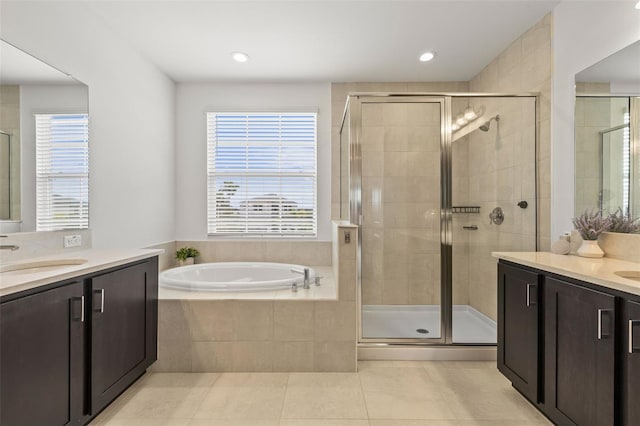 3541 Great Banyan Way, Wesley Chapel, FL 33543 - full bath featuring vanity, tile patterned flooring, a shower stall, a bath, and plenty of natural light