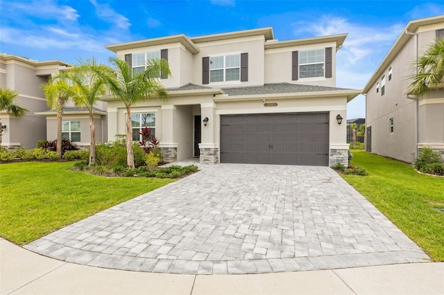 3541 Great Banyan Way, Wesley Chapel, FL 33543 - view of front of home featuring stucco siding, decorative driveway, and an attached garage