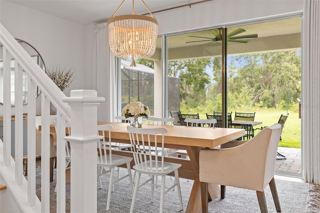 3541 Great Banyan Way, Wesley Chapel, FL 33543 - dining room with plenty of natural light, a chandelier, and ceiling fan