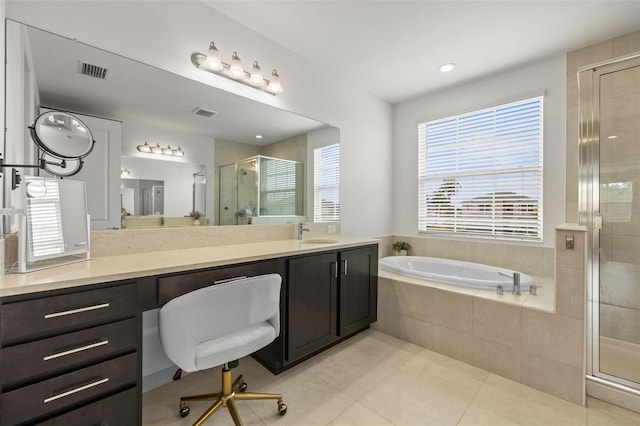 3541 Great Banyan Way, Wesley Chapel, FL 33543 - full bath featuring a shower stall, vanity, a garden tub, and tile patterned floors