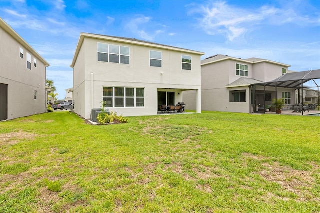 3541 Great Banyan Way, Wesley Chapel, FL 33543 - back of property featuring stucco siding, a patio, and a yard
