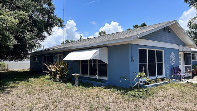 5719 13th St E, Bradenton, FL 34203 - rear view of property featuring a shingled roof