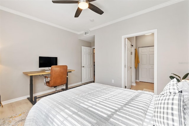 10412 White Lake Ct, Tampa, FL 33626 - bedroom featuring crown molding, wood finished floors, baseboards, and ceiling fan