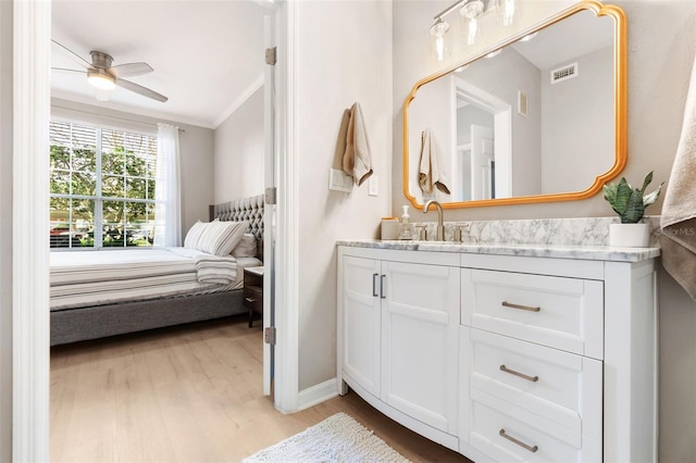 10412 White Lake Ct, Tampa, FL 33626 - bedroom featuring ornamental molding, light wood-style flooring, a sink, and baseboards
