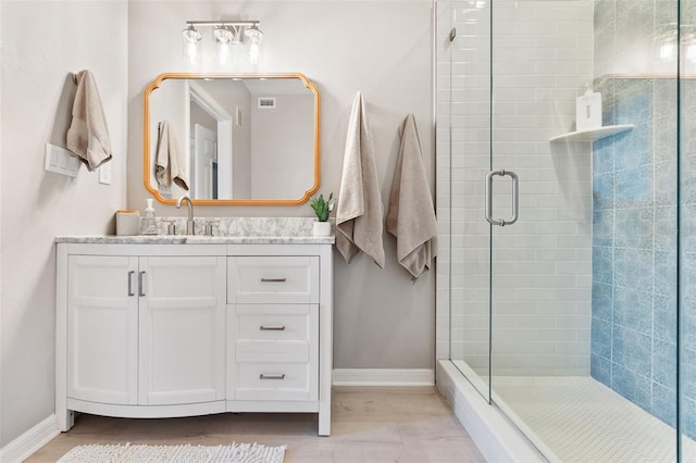 10412 White Lake Ct, Tampa, FL 33626 - bathroom with baseboards, a shower stall, and vanity