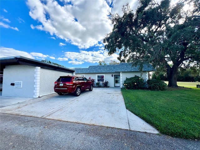 3725 Teeside Dr, New Port Richey, FL 34655 - single story home with a front yard, driveway, and stucco siding