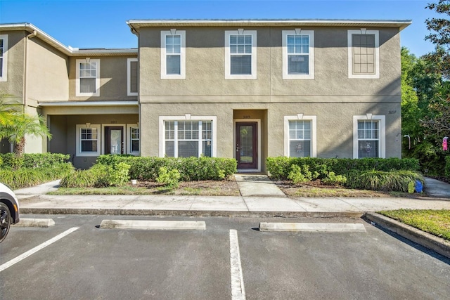 31215 Flannery Ct, Wesley Chapel, FL 33543 - multi unit property with stucco siding and uncovered parking