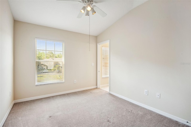 31215 Flannery Ct, Wesley Chapel, FL 33543 - spare room with carpet floors, ceiling fan, baseboards, and vaulted ceiling