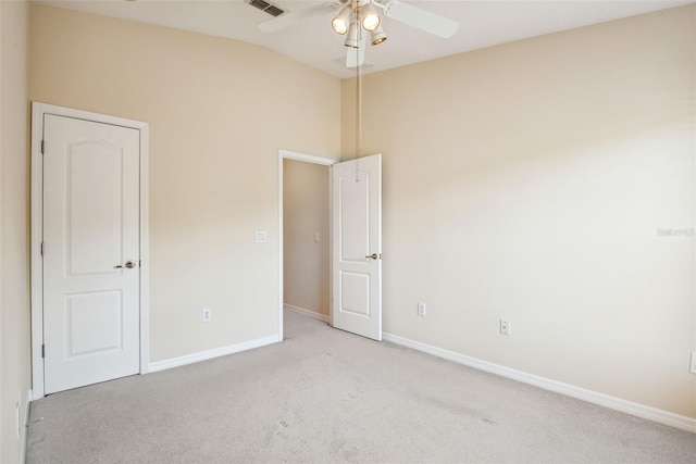 31215 Flannery Ct, Wesley Chapel, FL 33543 - empty room featuring vaulted ceiling, a ceiling fan, light carpet, and baseboards