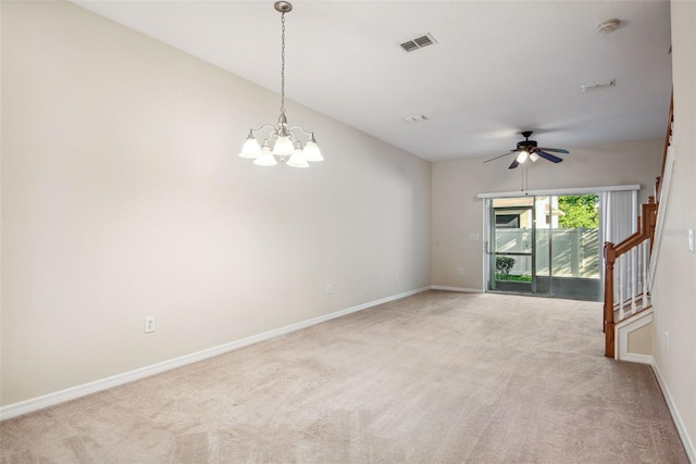 31215 Flannery Ct, Wesley Chapel, FL 33543 - empty room featuring light carpet, baseboards, a ceiling fan, a chandelier, and a smoke detector