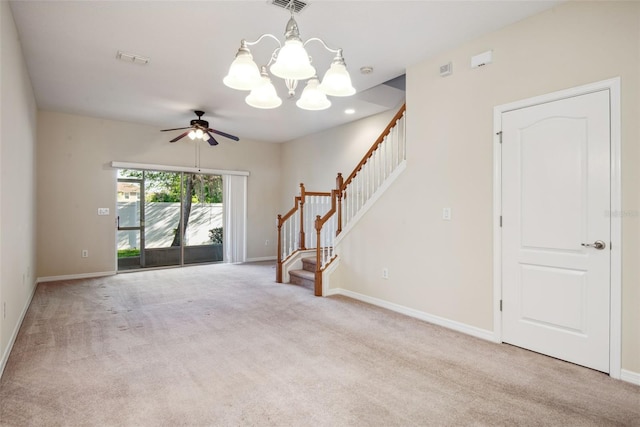 31215 Flannery Ct, Wesley Chapel, FL 33543 - unfurnished living room with stairway, carpet floors, a chandelier, and baseboards