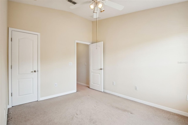 31215 Flannery Ct, Wesley Chapel, FL 33543 - empty room featuring lofted ceiling, a ceiling fan, light carpet, and baseboards