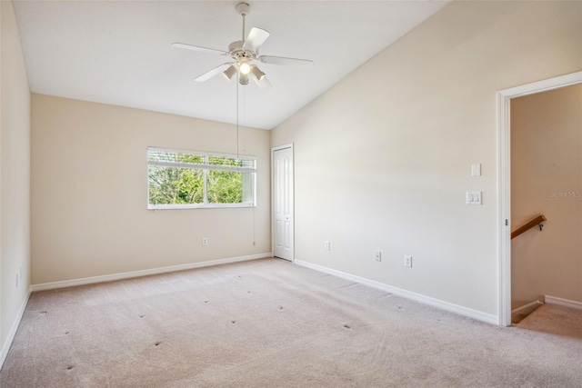 31215 Flannery Ct, Wesley Chapel, FL 33543 - carpeted empty room featuring baseboards, vaulted ceiling, and a ceiling fan