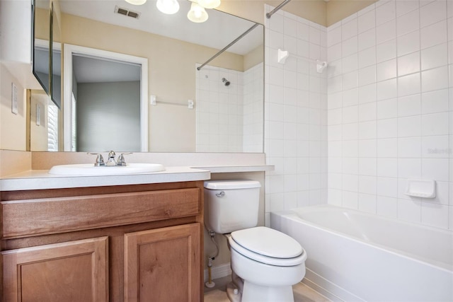 31215 Flannery Ct, Wesley Chapel, FL 33543 - bathroom featuring toilet, washtub / shower combination, and vanity