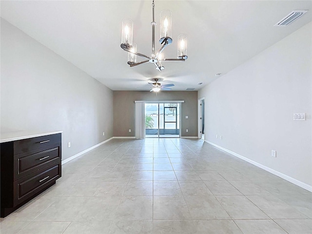 10347 Heron Hideaway Loop, Land O Lakes, FL 34638 - spare room featuring a chandelier, a ceiling fan, light tile patterned floors, and baseboards