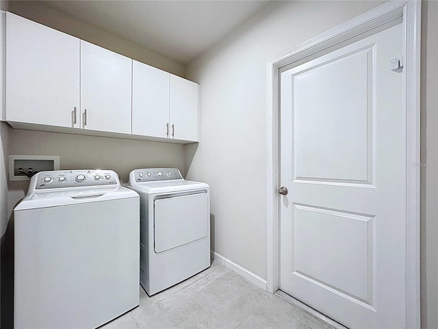 10347 Heron Hideaway Loop, Land O Lakes, FL 34638 - laundry area featuring cabinet space, independent washer and dryer, and baseboards