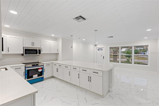 3552 Middletown St, Port Charlotte, FL 33952 - kitchen with stainless steel appliances, light marble finish flooring, a peninsula, recessed lighting, and light countertops
