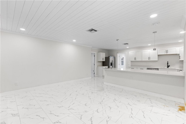 3552 Middletown St, Port Charlotte, FL 33952 - kitchen with stainless steel refrigerator with ice dispenser, recessed lighting, light countertops, white cabinetry, and baseboards