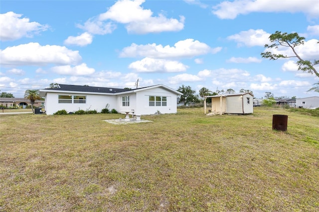 3552 Middletown St, Port Charlotte, FL 33952 - rear view of house with a lawn and stucco siding